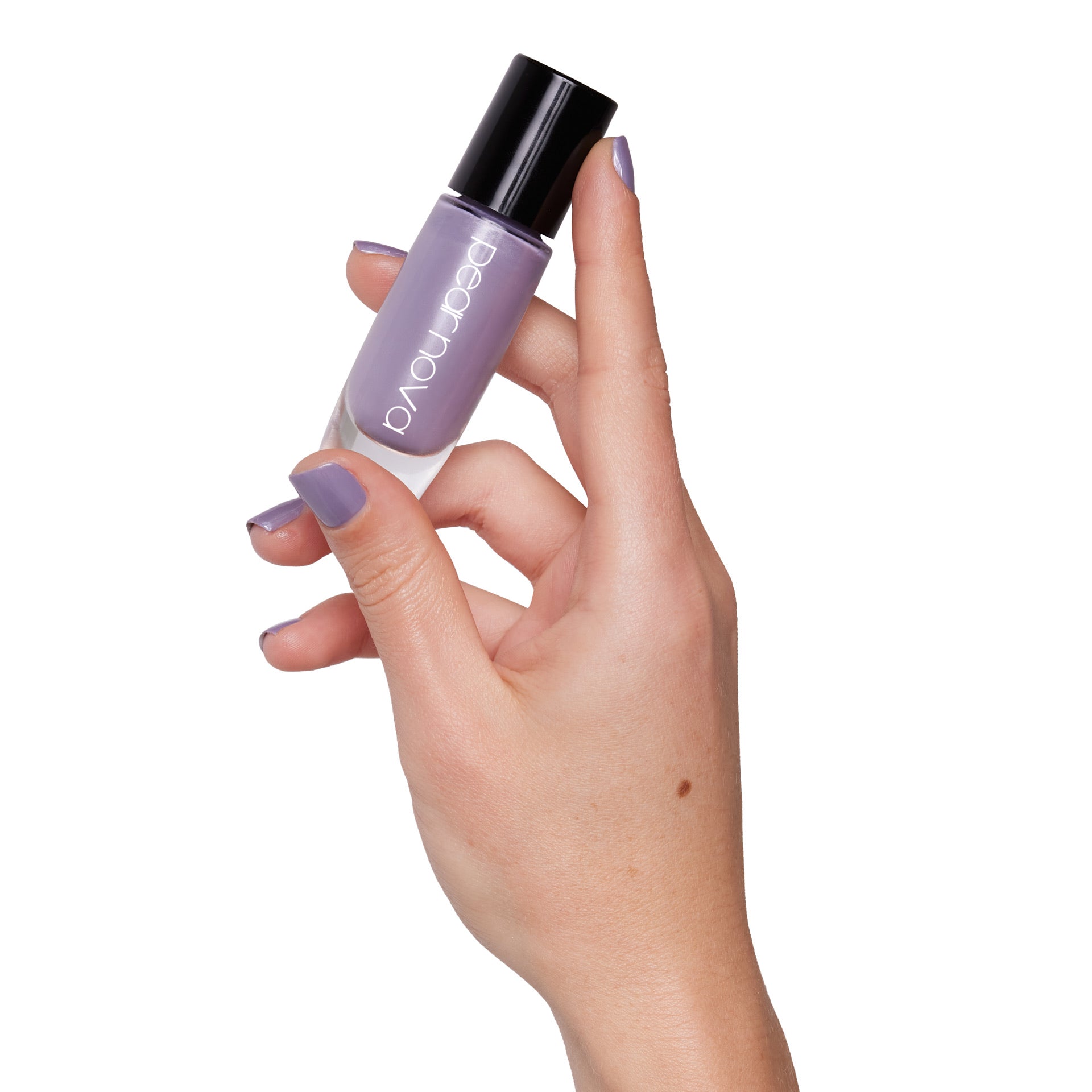 hand model holding bottle of nail lacquer with Night Fades, Morning Haze painted nails