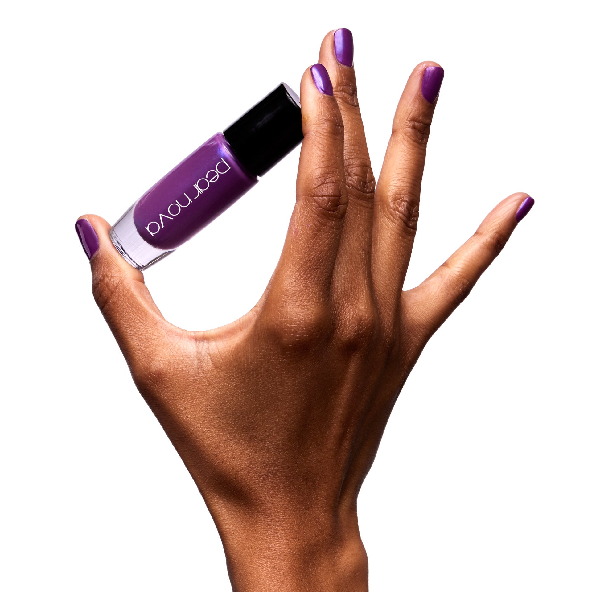 brown skin hand model holding bottle of nail lacquer with Rooftop Til You Drop painted nails