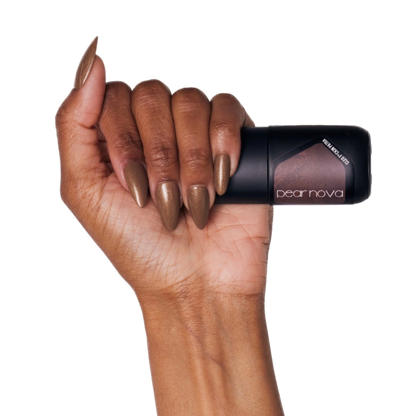 brown skin hand model holding bottle of nail lacquer with almond shaped painted nails 